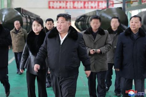 Kim Jong Un visits missile launcher factory, warns of ‘military showdown’