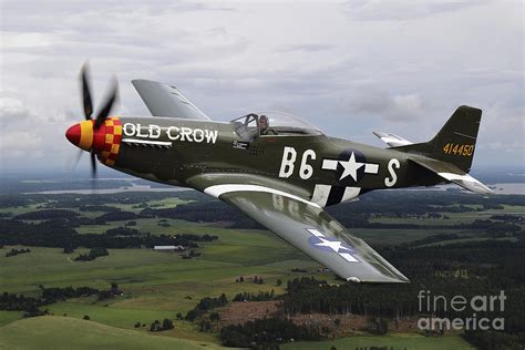 A North American P-51 Mustang In Flight Photograph by Daniel Karlsson