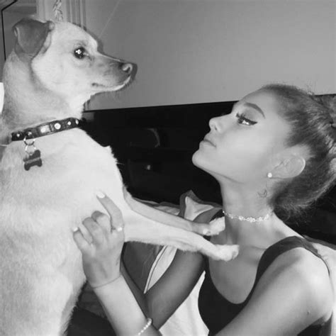 Back of the neck moon tattoo on Ariana Grande.