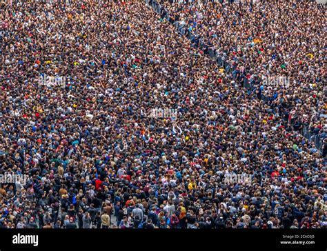 large crowd of spectators having fun at stadium selective focus ...