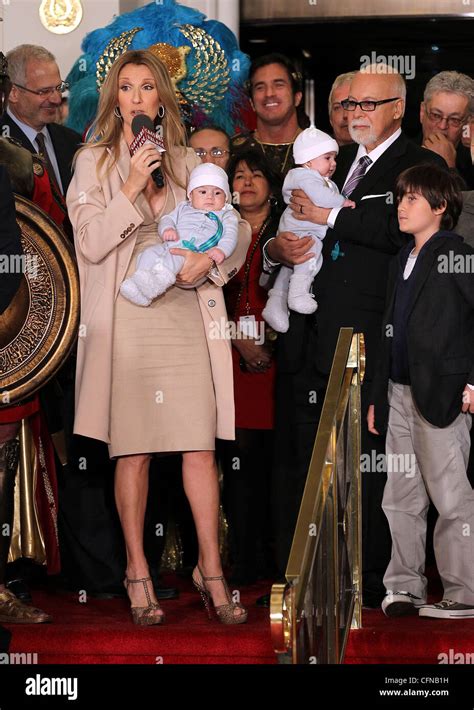 Singer Celine Dion holds her son Nelson Angelil next to her husband Stock Photo: 44110237 - Alamy