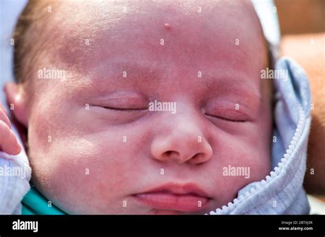 Closeup of newborn sleeping baby face outdoor Stock Photo - Alamy