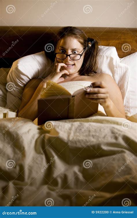 Woman Reading In Bed Stock Photo - Image: 5922200