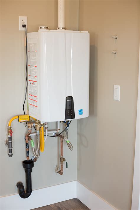 A natural gas 94% efficiency tankless hot water heater provides endless ...