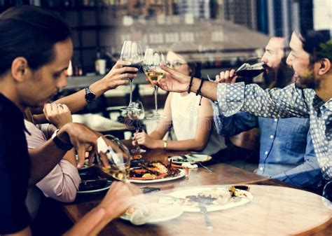 Friends Having Lunch Time Together Stock Photo - Image of meeting, toast: 114745112