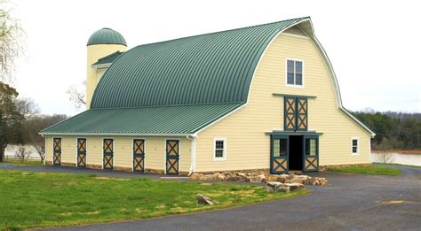 Gothic arch barn with (curved) standing seam metal roof and shed roof wings. Wow! | Barns ...