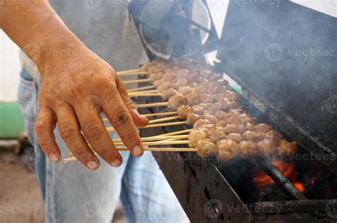 Grilled meatballs in skewers, bakso pentol bakar with soy sauce ...