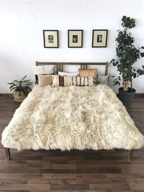 Ivory Plush Sheepskin Bed Cover / Rug | Sheepskin blanket, Scandinavian decor, Bed covers