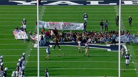 LOOK: Harvard-Yale football game delayed for 48 minutes due to on-field protest over climate ...