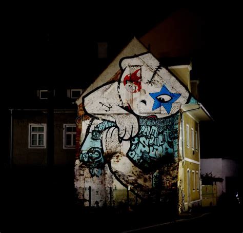 Frontal View of an Urban House with a Massive Graffiti on the Frontage in a Big City at Night ...