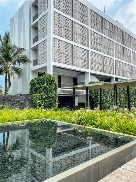 Exposed Concrete Roster Facade for this Hotel Building with Pond Stock Photo - Image of green ...