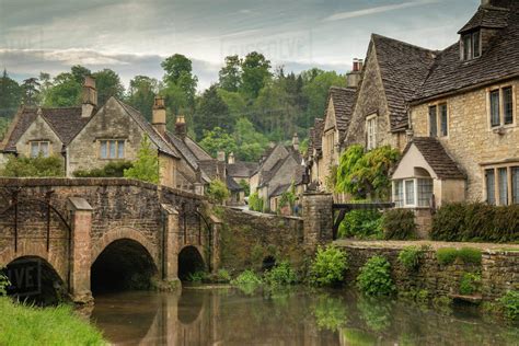 The picturesque Cotswolds village of Castle Combe, Wiltshire, England, United Kingdom, Europe ...