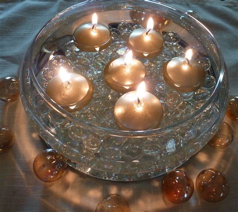 How to Make a Floating Candle Centerpiece | Floating candles bowl, Floating candle centerpieces ...