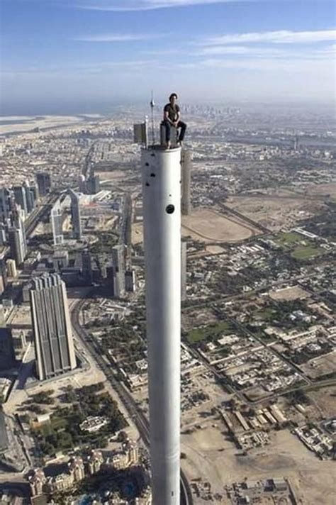 Tom Cruise casually sitting on top of the Burj Khalifa - 9GAG