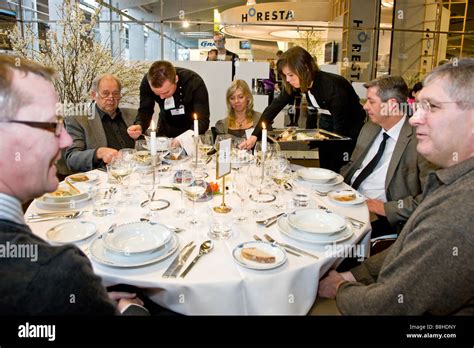 Two waiters serving food at the waiters championship Stock Photo - Alamy