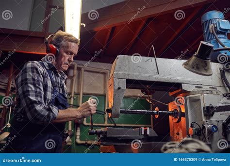 Operator working on lathe stock image. Image of metalwork - 166370309