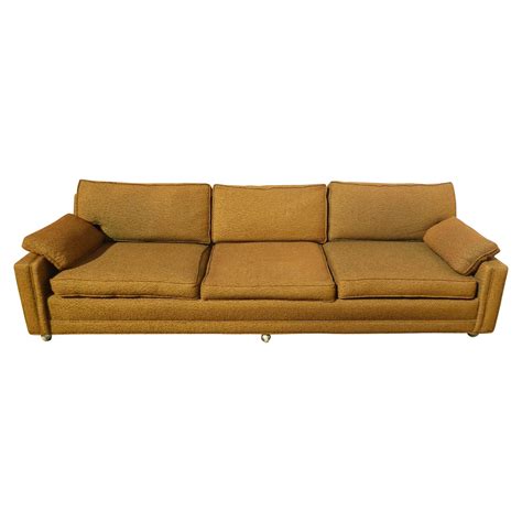 Mid Century Modern Gold Sofa on Castors | Chairish