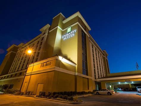 the exterior of a hotel lit up at night