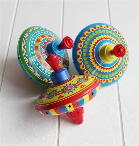 Traditional Tin Spinning Top | Traditional toys, Spinning top, Spinning