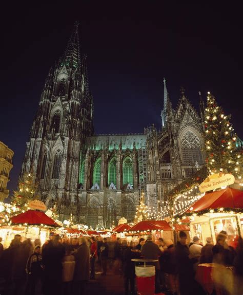 Cologne Cathedral And Christmas Market by Axiom Photographic