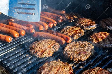 Burgers and Dogs on the Grill Stock Photo - Image of cooking, summer ...