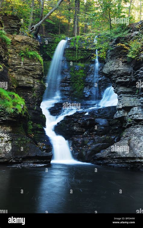 Waterfall in woods in Autumn with rocks in mountain Stock Photo - Alamy