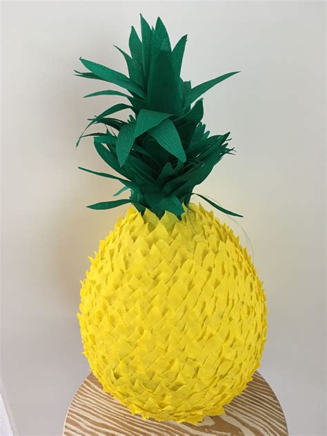 Home made pineapple pinata I made for my little girls tropical birthday party