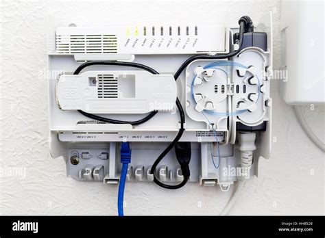 NBN connection box with th cover open on a wall inside a home Stock Photo - Alamy