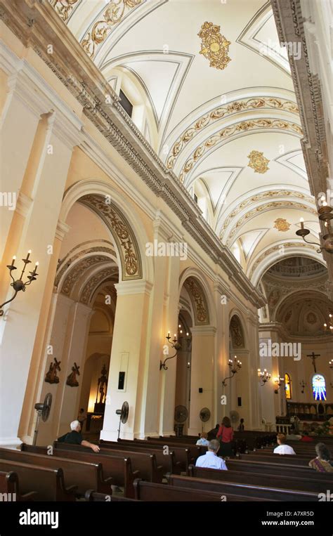 PUERTO RICO San Juan Catedral de San Juan interior or church pews columns and arches Stock Photo ...