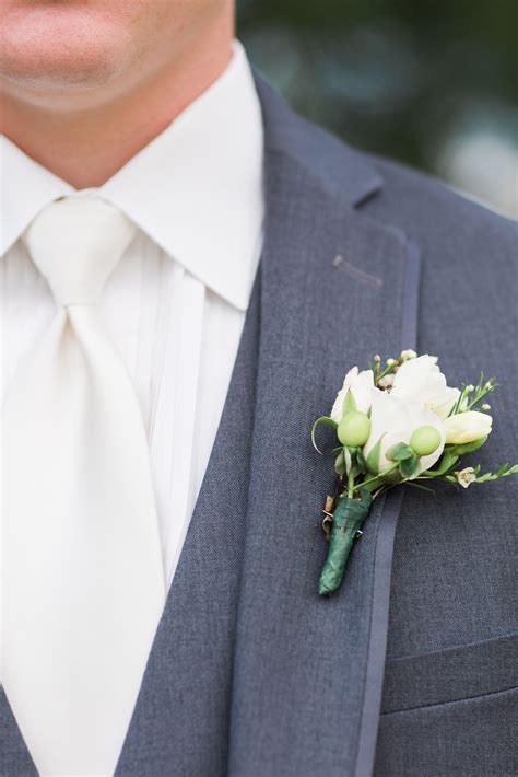 Groom’s White Rose and Freesia Boutonniere