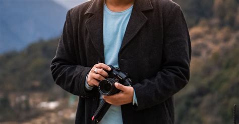 Man Holding Dslr Camera · Free Stock Photo