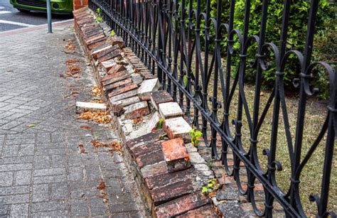 The Old Brick Fence Needs To Be Repaired. Stock Photo - Image of europe ...