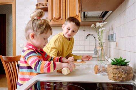 Premium Photo | Funny kids bake cookies in kitchen. happy family.