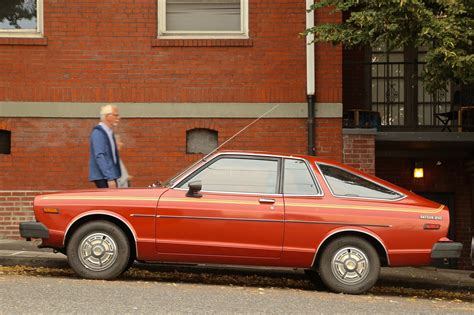 OLD PARKED CARS.: 1979 Datsun 210.