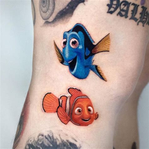 Nemo and Dory tattoo located on the knee.