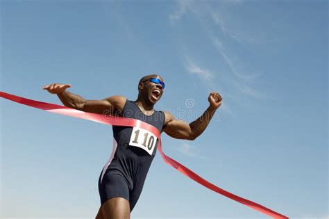 Male Runner Winning Race stock photo. Image of person - 30843844