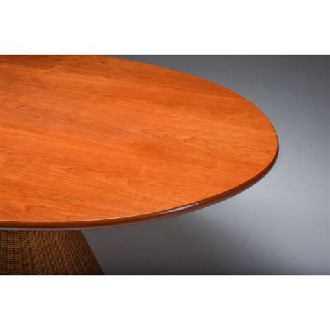 Italian vintage oval dining table on a rattan base, 1970s