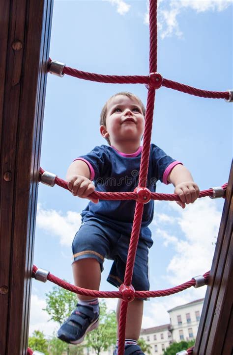 Child Climbing Ropes in a Playground Stock Image - Image of leisure, play: 55731223