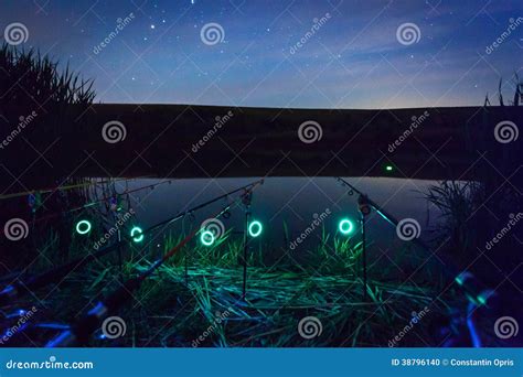 Fishing rods at night stock photo. Image of relaxation - 38796140