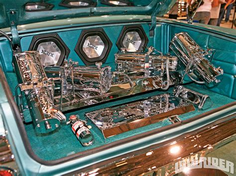 1964 Chevrolet Impala Hydraulics - 4 Chrome Hi-Low Pumps - Lowrider Magazine