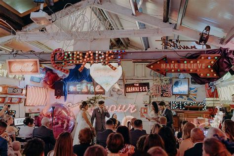 Gods Own Junkyard Wedding With Neon Signs & Lace Wedding Dress