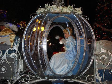 an elaborate carriage is decorated with white flowers and blue tinsels ...