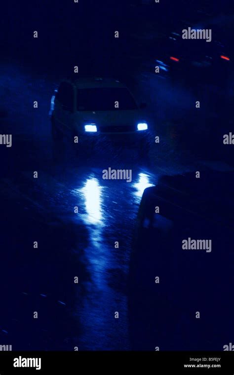 fast car driving in heavy rain at night in town Stock Photo - Alamy