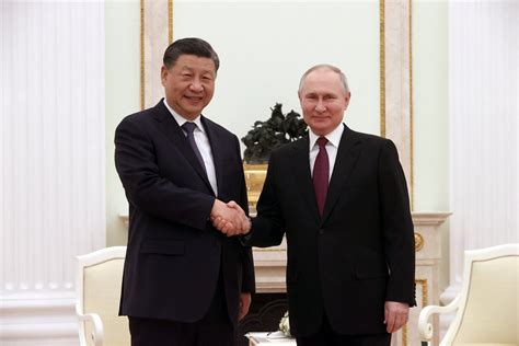 China's Xi pledges to promote multipolar world in meeting with Putin ...