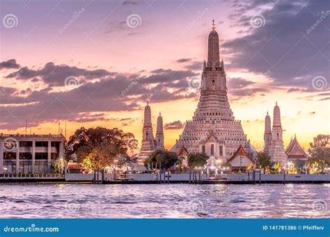 Beautiful Sunset with Wat Arun Temple of Dawn in Bangkok, Thailand Stock Photo - Image of clouds ...