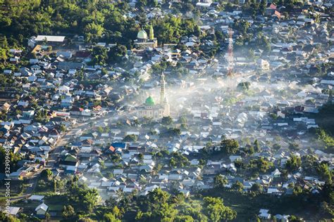 Aerial view of the Sembalun village illuminated at sunrise. Sembalun is ...