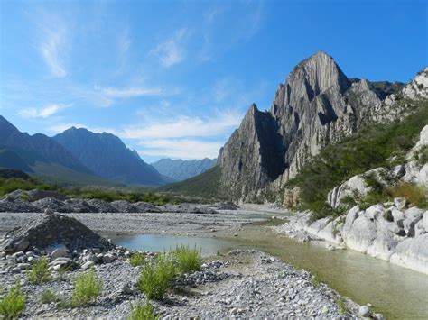 there is a river in the middle of mountains