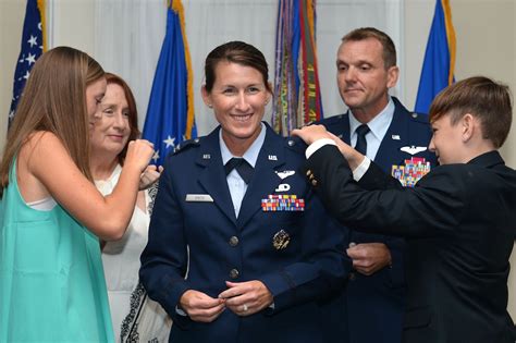 Colonel promotes wife, performs last official duty in AF before retiring