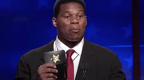 Herschel Walker Flashes 'Prop' Badge at Georgia Senate Debate