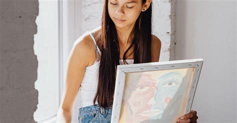 Photograph of a Girl Painting Beside a Window · Free Stock Photo